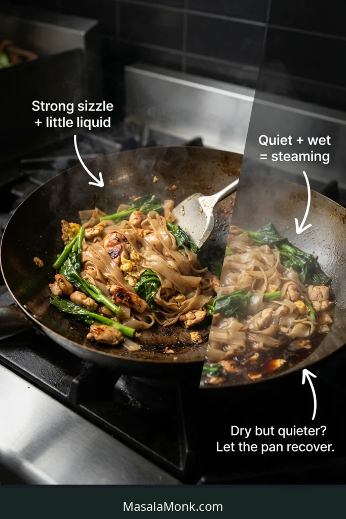 Wide rice noodles sizzling with little loose liquid compared with pale noodles sitting in visible liquid and steam.