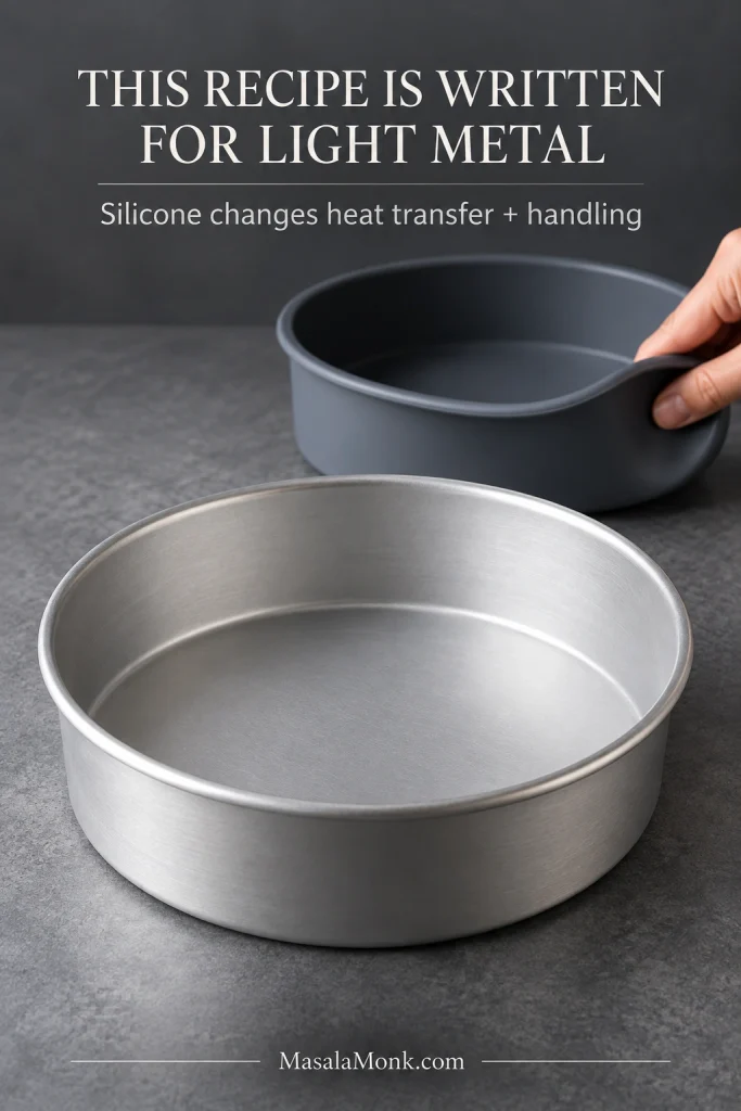 Rigid light-colored metal cake pan beside a dark silicone pan whose rim bends inward under a person's hand.
